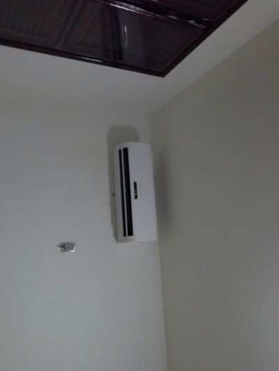 Testing air-conditioning remote control on the wall